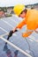 Engineer Adjusting Solar Panels