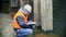 Engineer checking documentation near the bridge supports