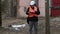 Engineer checking documentation near powerline