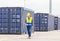 Engineer with clipboard checklist in industry containers cargo, Foreman dock worker in hardhat and safety vest control loading