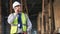 Engineer, construction and phone of a man outdoor for building project management. Senior contractor person talking to