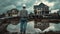 an engineer dressed in jeans and a shirt, donning a white helmet, standing in front of an unfinished house under