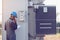 engineer or electrician working on checking and maintenance equipment at green energy solar power plant; checking status step up