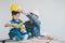 Engineer Father placing safety hat for his son to teach him about work safety