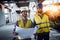 Engineer, foreman and worker discussing in building construction site