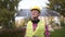 Engineer at green energy company, wearing yellow helmet on head and getting ready for work day. Project supervisor of