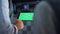 Engineer hands holding tablet computer with chroma key screen at farm facility.