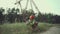 Engineer having lunch near power lines and electricity pylons in the field. An electrical substation worker in a