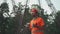 Engineer having lunch near power lines and electricity pylons in the field. An electrical substation worker in a