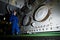 Engineer inspecting engine interior in offshore installation