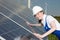 Engineer or installer inspecting solar energy panels