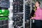 An engineer with an Internet switch is near the racks with computer equipment. The system administrator works in the server room