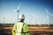 Engineer Looking at Wind Turbines, Generative AI