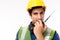 Engineer man work in hardhat, reflective vest. Industrial engineer worker use walkie talkie or radio talking with crew or team for