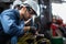 Engineer manual workers standing in a aluminum mill and working together