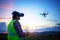 Engineer operate Drone flying for survey construction wind farm