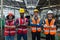 Engineer professional successful team corporate workers crossed arms standing in factory. teamwork technician inspector
