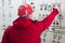 Engineer with red helmet give command in power plant control center