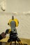 An engineer\\\'s hand using a total station for topographic measurements
