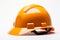 Engineer safety isolated yellow and orange helmet on a white background