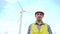 Engineer saying in front of wind turbines ecological energy industry power windmill