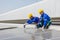 Engineer set installing and inspect standards of solar panels on roof of an industrial factory. Team technician inspection and