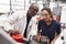 Engineer showing equipment to a female apprentice, close up