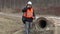 Engineer with smart phone at the concrete pipes
