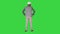 Engineer standing and looking around on a green screen, chroma key.