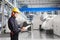 Engineer taking notes for maintenance work in thermal powerhouse