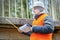 Engineer with tape measure and documentation under the bridge