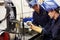 Engineer Teaching Apprentice To Use TIG Welding Machine