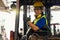 Engineer or technician Concept. A male employee driving a forklift and showing thumb up in factory
