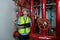 Engineer or technician work checking Fire suppression system and fire equipment. Engineer check red generator pump for water sprin