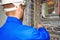 Engineer tests the automation cabinet with industrial equipment controllers