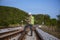 The engineer under inspection and checking construction railroad station .Engineer wearing safety uniform and safety helmet in wor