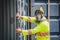 Engineer wear PPE checking inside container as Chemical spill in the container shipping industry