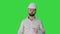 Engineer in a white helmet explaining something to camera on a Green Screen, Chroma Key.