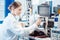 Engineer woman measuring electronic product on test bench