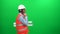 Engineer worker with blueprints talking with cell phone, green screen background