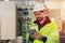 Engineer worker working checking maintenance electricity fuse box in and power line in factory