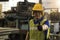 An engineer working in the the industrial. Asian portrait of a young engineer man wear a safety helmet showing thumb up