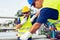 Engineer working in a oil refinery with talking on the portable radio for controlling work