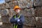 Engineer working at a pile of scrap metal recycling and recycling industry. engineers standing in recycling center outdoors