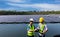 Engineer working setup Floating solar panels or solar cell Platform system on the lake. Engineer or worker work on site Floating s