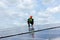Engineer working setup Solar panel at the roof top. Engineer or worker work on solar panels or solar cells on the roof of business