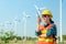 Engineering Asian woman is checking wind turbine Renewable energy concepts