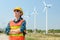 Engineering Asian women are working happily in nature, wind turbines, energy