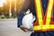 Engineering holds white safety hats and electric pole background