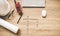 Engineering tools on work table for construction project with a white helmet, radio and blueprints. Words of engineer concepts col